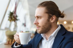 hair transplant handsome man-drinking coffee